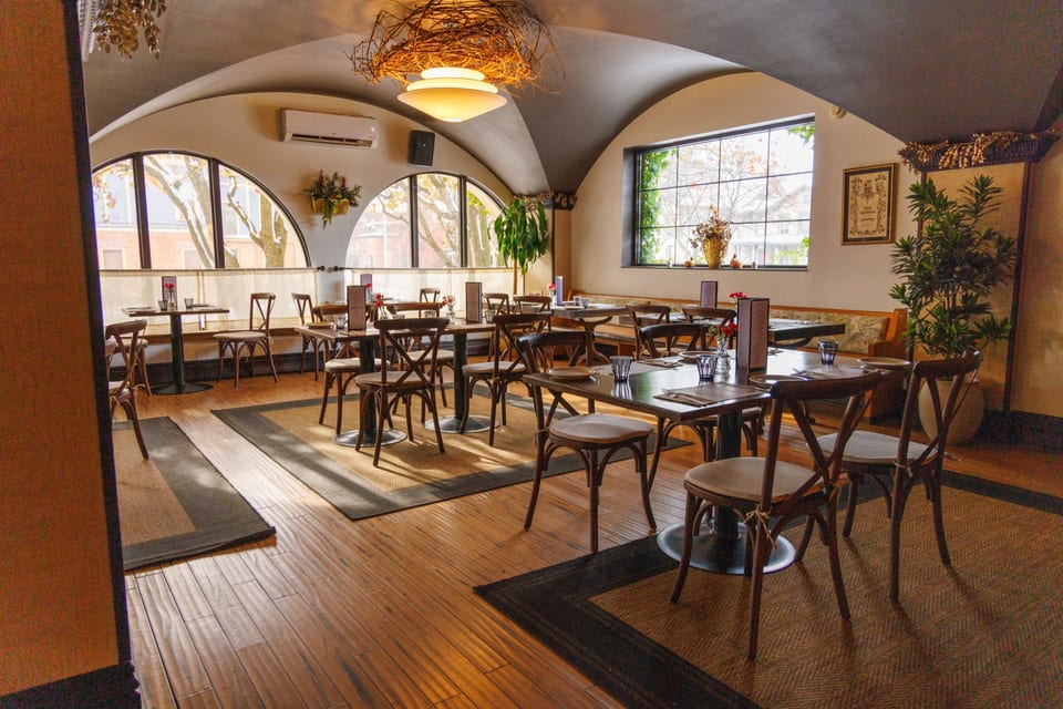 The main dining room with Victorian details and floor-to-ceiling windows
